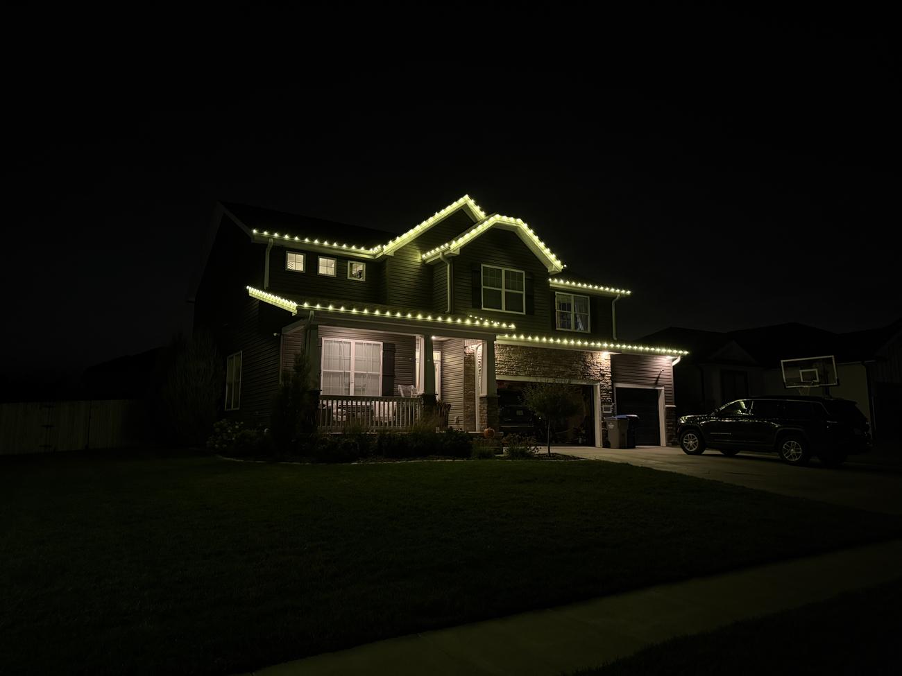 Holiday lighting installation on a Lincoln home
